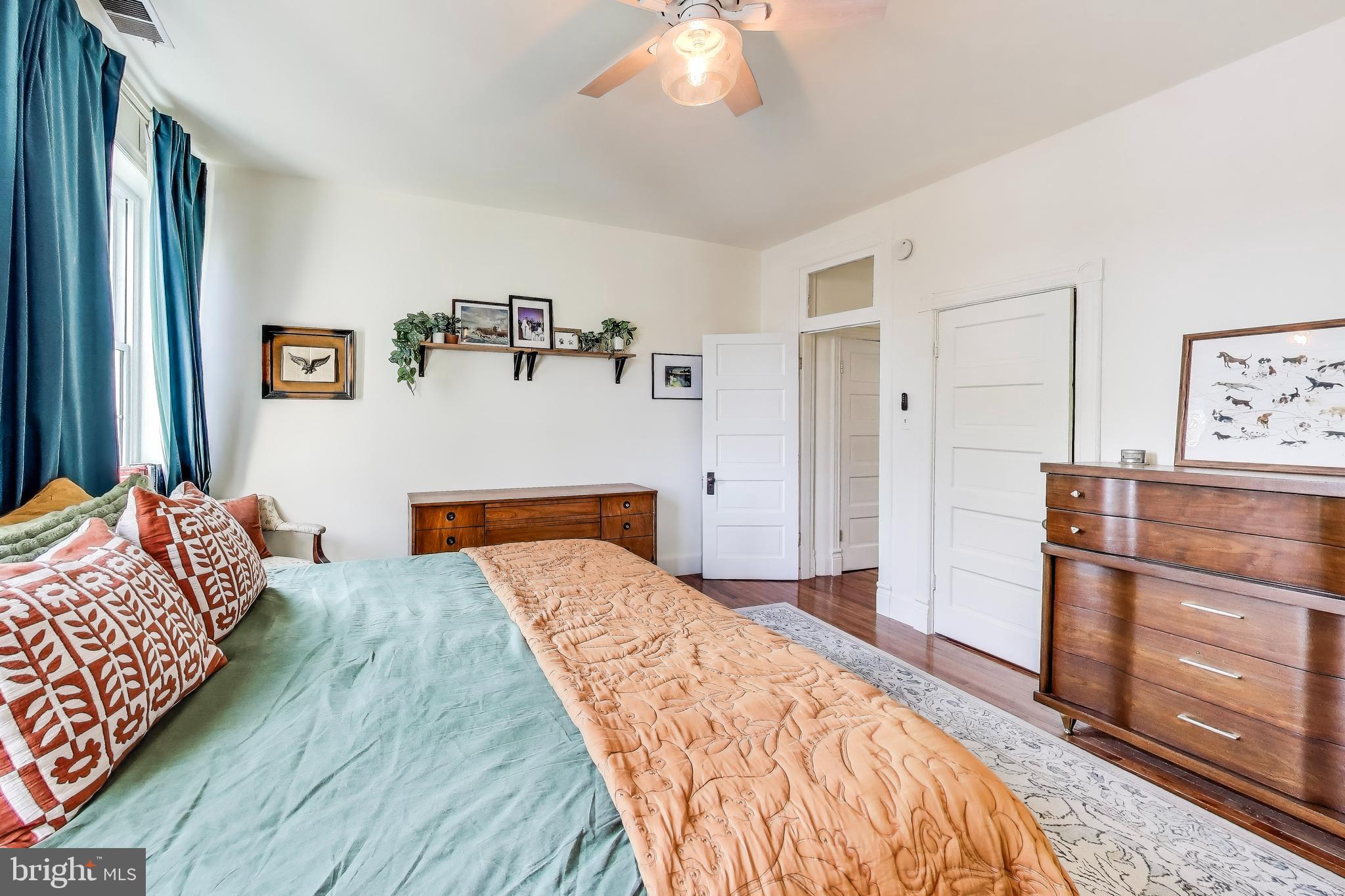 1236 D Street Southeast Washington, DC 20003 - Photo 15 of 31 a bedroom with a bed and wooden floor