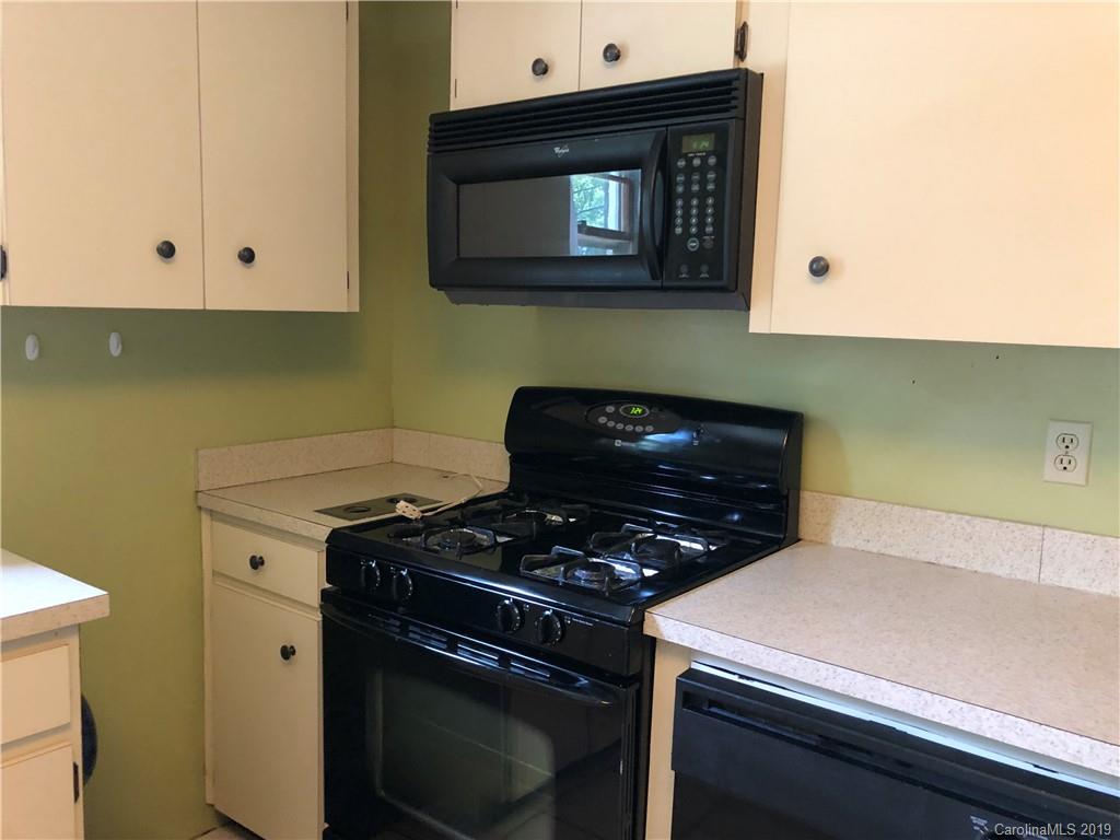 87 Cresent Loop Canton, NC 28716 - Photo 14 of 31 a kitchen with a stove and a microwave