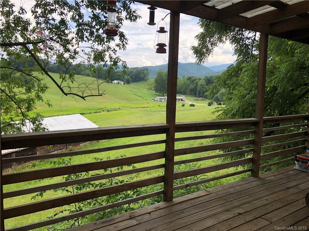 87 Cresent Loop Canton, NC 28716 - Photo 29 of 31 a view of a two chairs next to a yard
