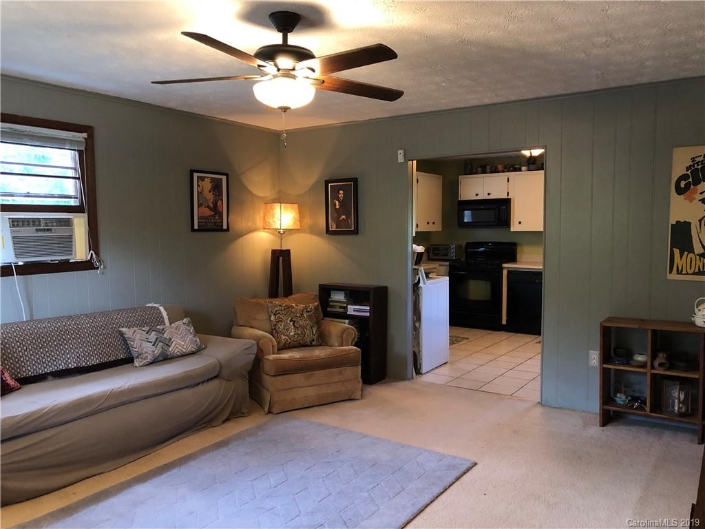 87 Cresent Loop Canton, NC 28716 - Photo 5 of 31 a living room with furniture and a flat screen tv
