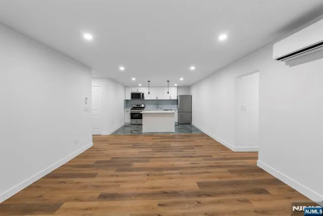 a view of kitchen with wooden floor