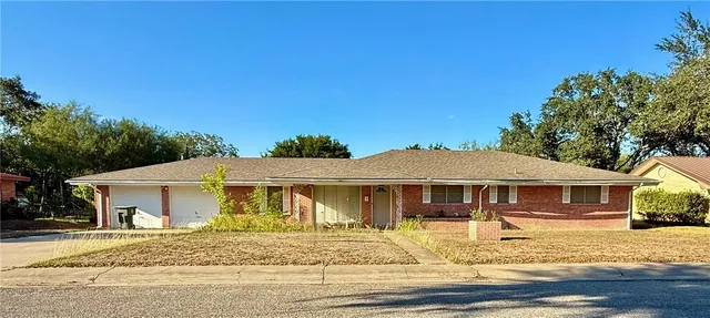 a front view of a house with a patio