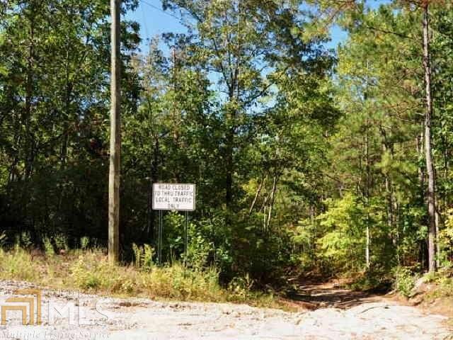 3312 South McKoy Road Villa Rica, GA 30180 - Photo 4 of 17 a sign that is sitting in front of a tree