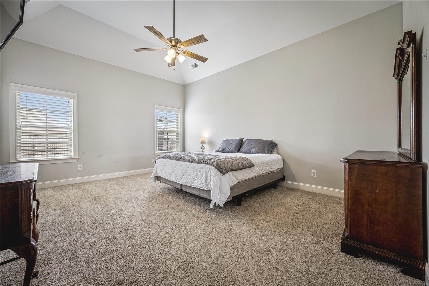 12802 Longmire Loop South Arlington, TN 38002 - Photo 17 of 40 a bedroom with a bed and a ceiling fan