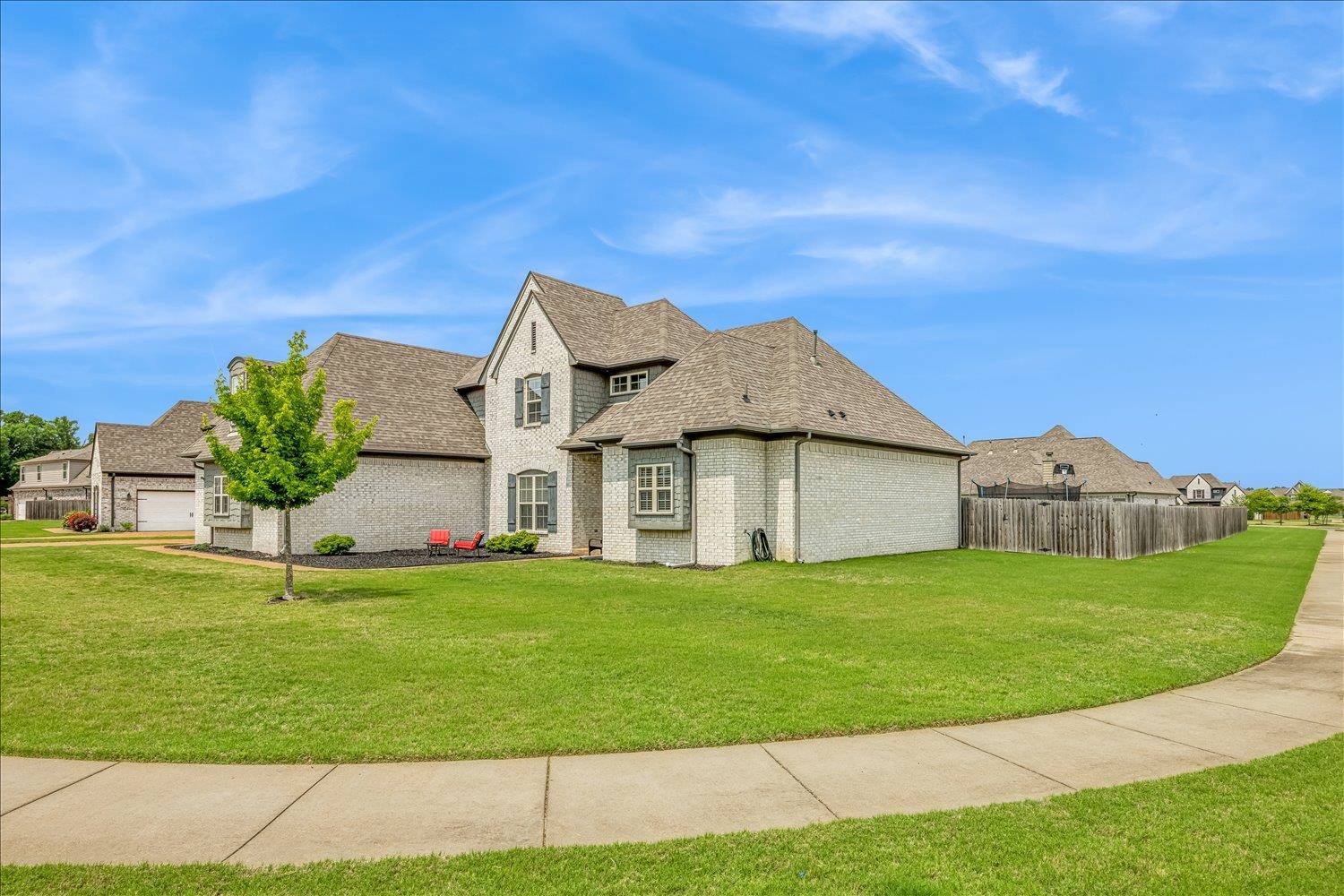 12802 Longmire Loop South Arlington, TN 38002 - Photo 2 of 40 a view of a big house with a big yard and palm trees