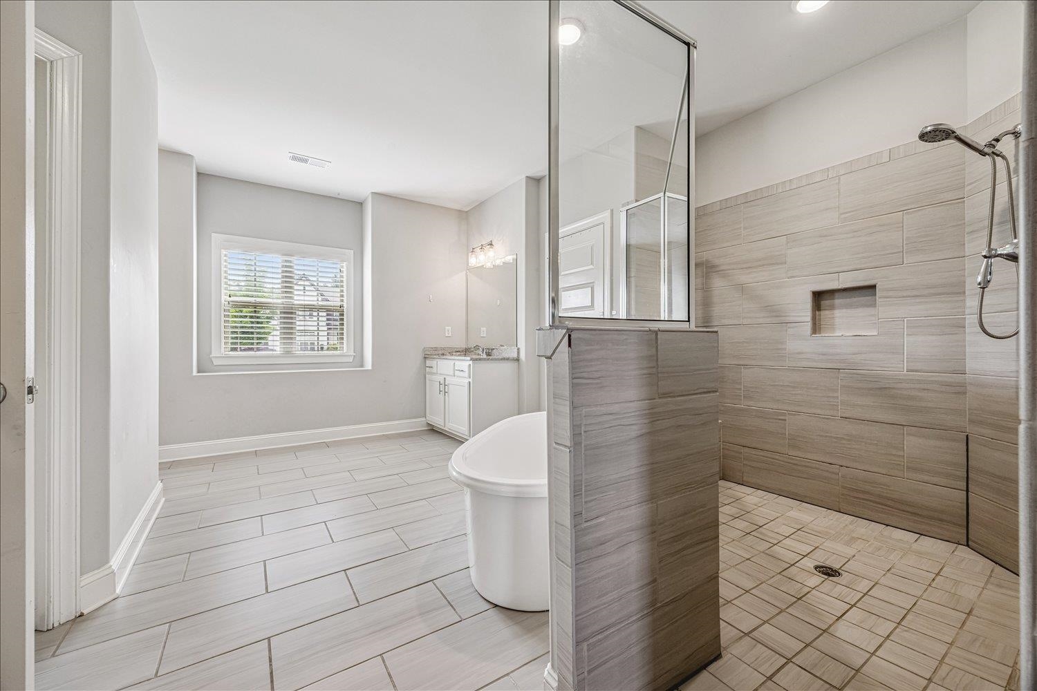12802 Longmire Loop South Arlington, TN 38002 - Photo 21 of 40 a bathroom with a granite countertop shower a toilet and a sink