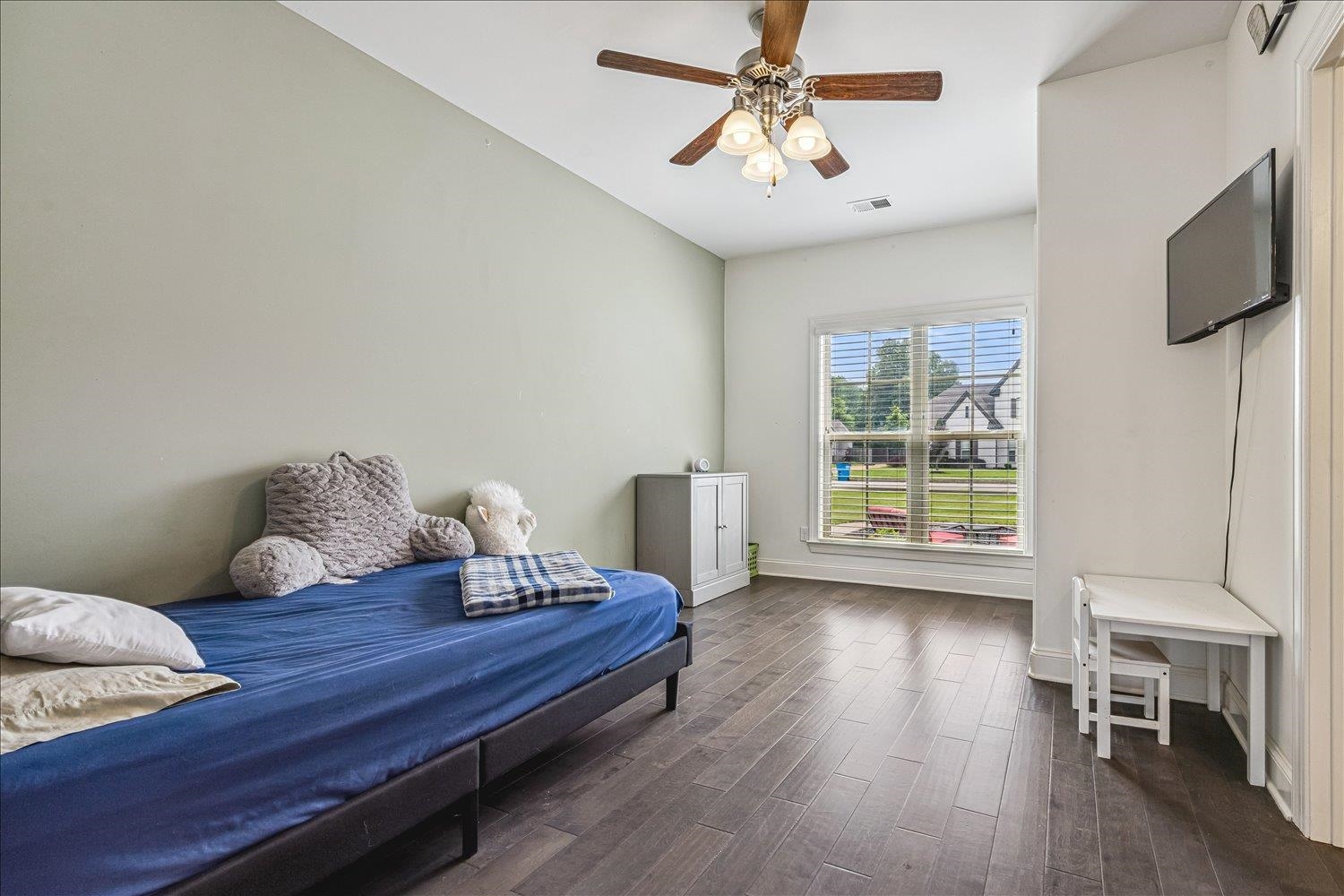 12802 Longmire Loop South Arlington, TN 38002 - Photo 23 of 40 a living room with furniture and a wooden floor