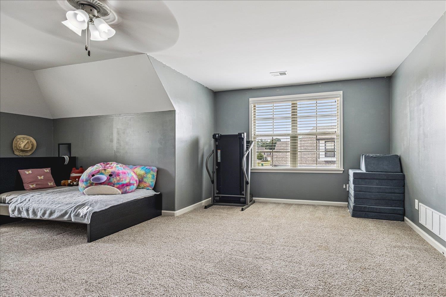 12802 Longmire Loop South Arlington, TN 38002 - Photo 35 of 40 a bedroom with a bed and window