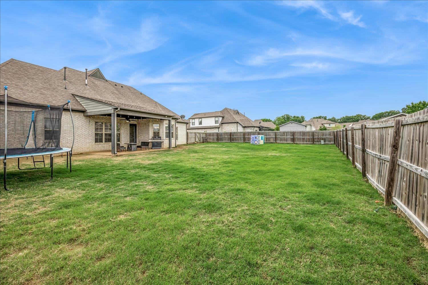 12802 Longmire Loop South Arlington, TN 38002 - Photo 37 of 40 a backyard of a house with table and chairs