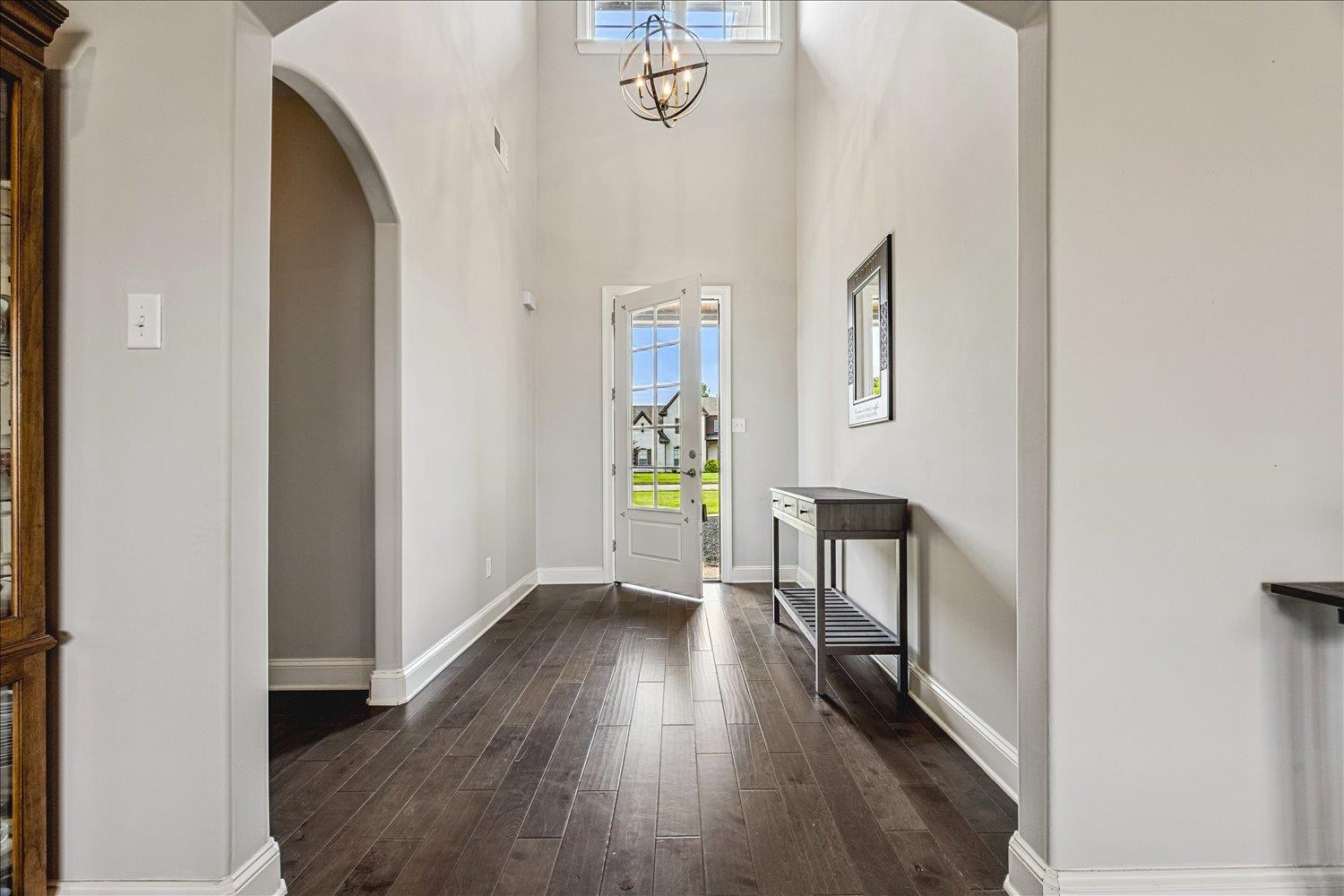12802 Longmire Loop South Arlington, TN 38002 - Photo 4 of 40 a view of an entryway with wooden floor