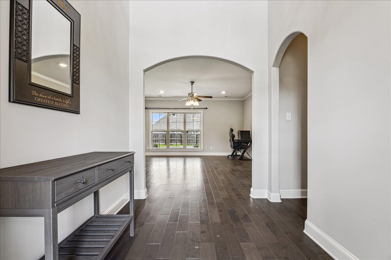 12802 Longmire Loop South Arlington, TN 38002 - Photo 5 of 40 a view of a hallway with wooden floor and staircase