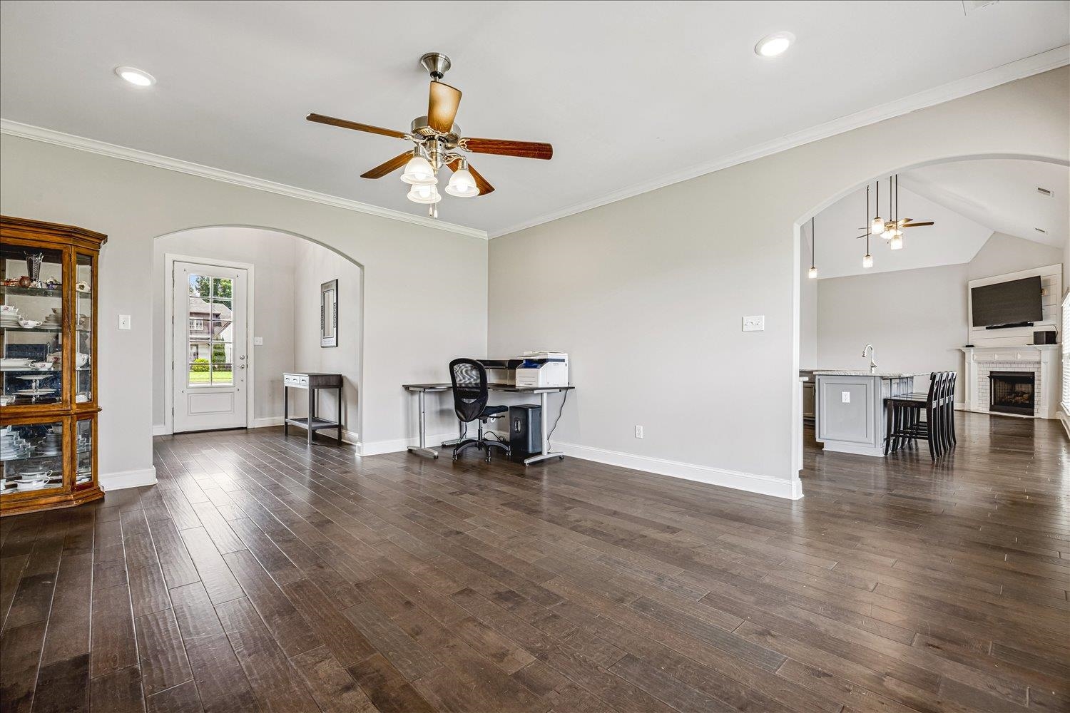 12802 Longmire Loop South Arlington, TN 38002 - Photo 7 of 40 a view of an empty room with window wooden floor and a ceiling fan