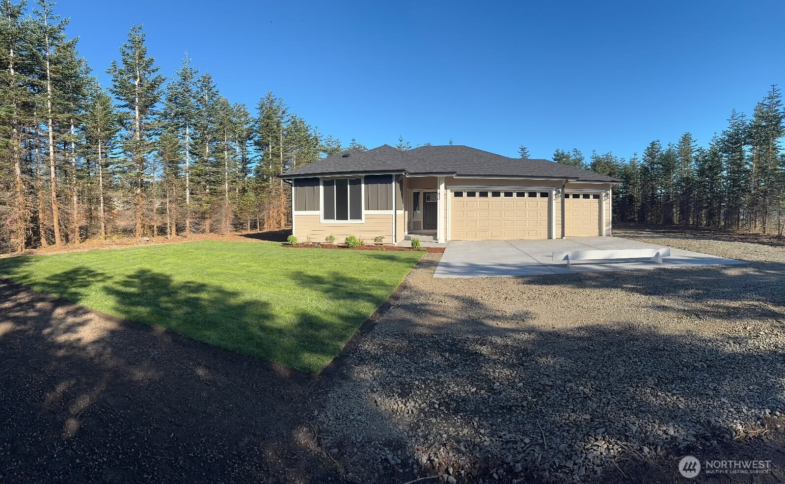 573 Monte Elma Road Montesano, WA 98563 - Photo 1 of 13 a front view of a house with a yard and garage