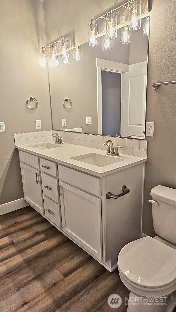 573 Monte Elma Road Montesano, WA 98563 - Photo 12 of 13 a bathroom with a toilet sink and mirror