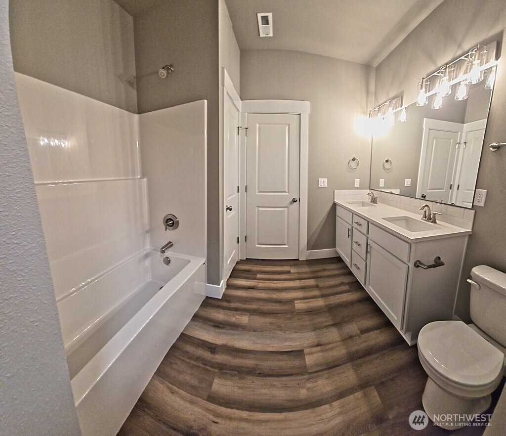 573 Monte Elma Road Montesano, WA 98563 - Photo 5 of 13 a bathroom with a sink and mirror with bathtub