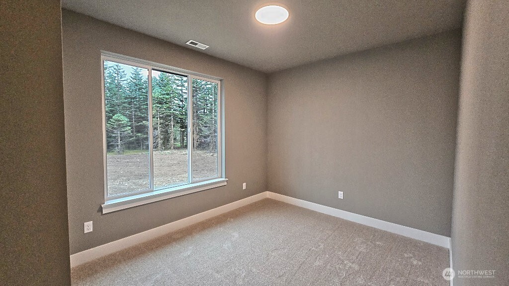 573 Monte Elma Road Montesano, WA 98563 - Photo 6 of 13 a view of an empty room with a window