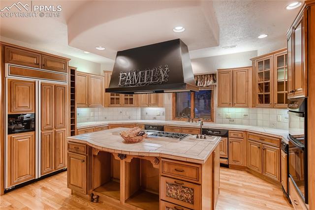 6155 Wilson Road Colorado Springs, CO 80919 - Photo 9 of 35 Kitchen includes two dishwashers and a trash compactor
