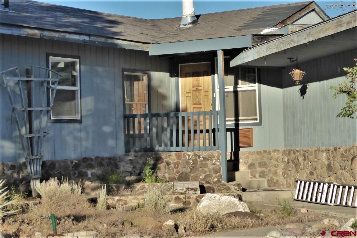 25352 Cedar Mesa Road Cedaredge, CO 81413 - Photo 2 of 32 a view of entrance gate of a building
