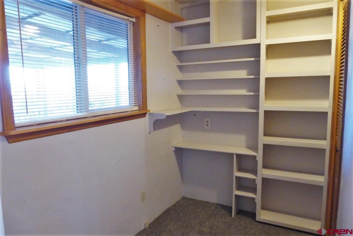 25352 Cedar Mesa Road Cedaredge, CO 81413 - Photo 10 of 32 a view of walk in closet with empty racks