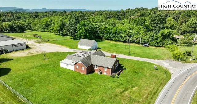 a view of a garden with a small pool