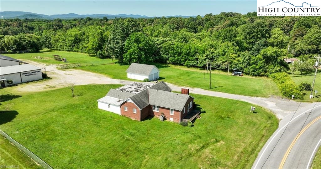 820 Suncrest Orchard Road North Wilkesboro, NC 28659 - Photo 1 of 41 a view of a garden with a small pool