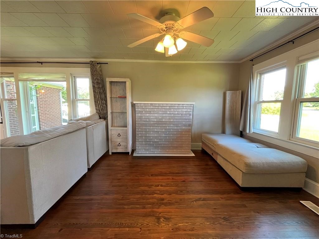 820 Suncrest Orchard Road North Wilkesboro, NC 28659 - Photo 25 of 41 a bedroom with a bed and a chandelier