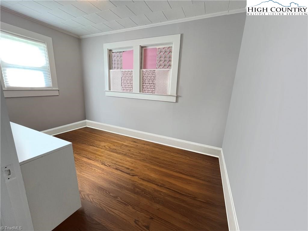 820 Suncrest Orchard Road North Wilkesboro, NC 28659 - Photo 29 of 41 an empty room with wooden floor and windows