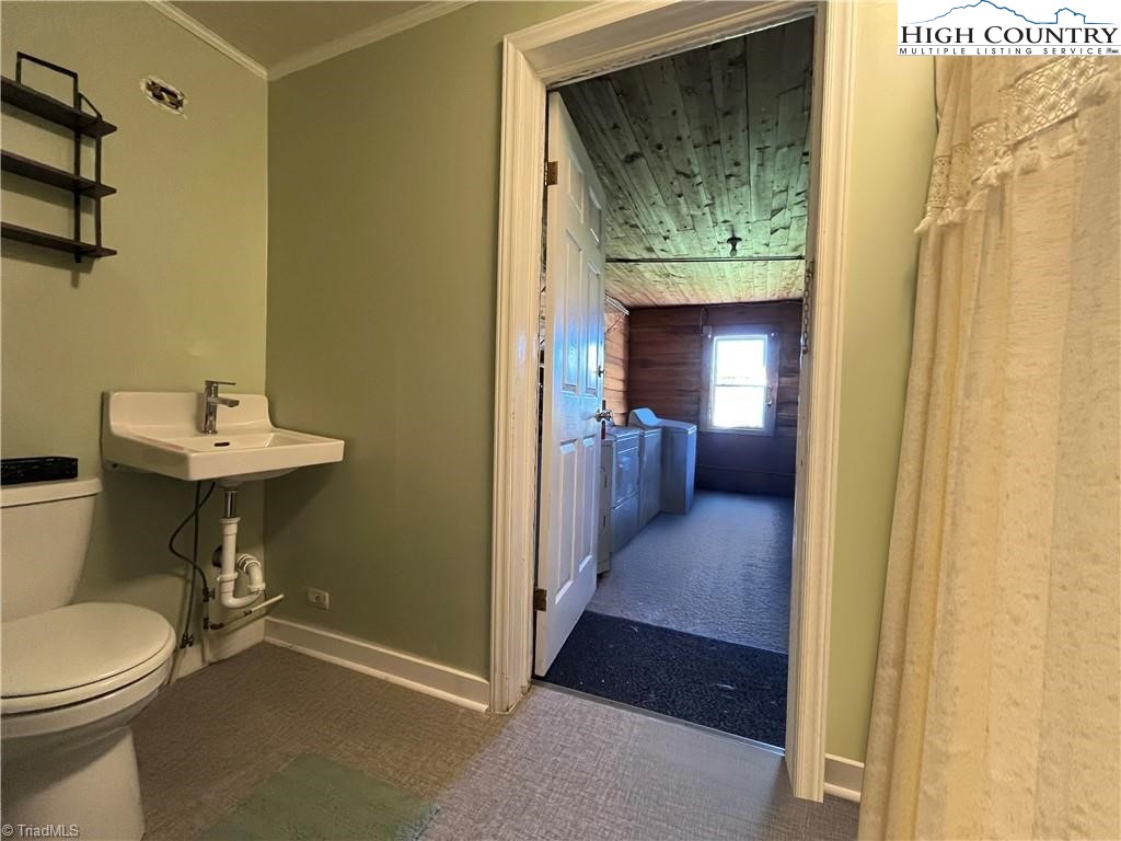 820 Suncrest Orchard Road North Wilkesboro, NC 28659 - Photo 32 of 41 a bathroom with a sink and a mirror