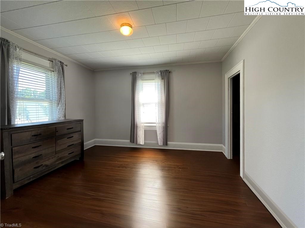 820 Suncrest Orchard Road North Wilkesboro, NC 28659 - Photo 34 of 41 an empty room with wooden floor and windows