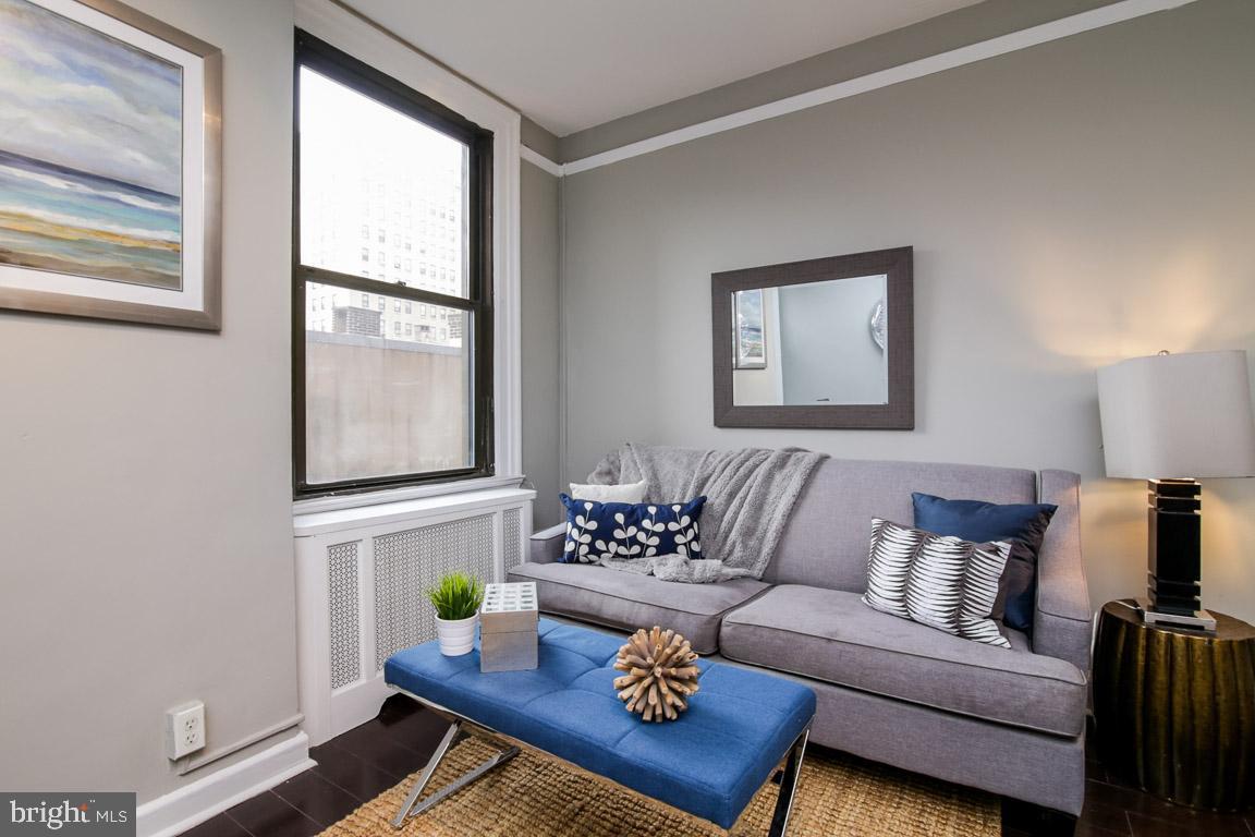 2031 Locust Street, Unit 203 Philadelphia, PA 19103 - Photo 2 of 17 a living room with furniture and a window