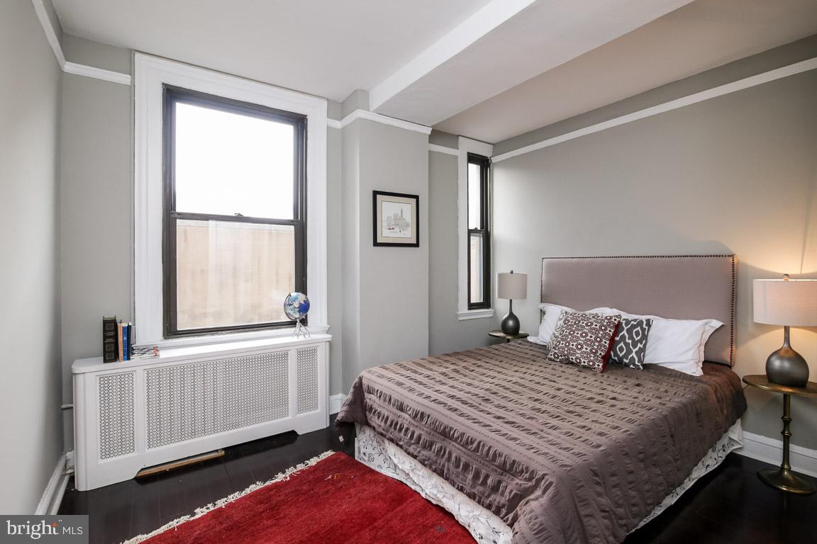 2031 Locust Street, Unit 203 Philadelphia, PA 19103 - Photo 6 of 17 a bedroom with a bed and a window