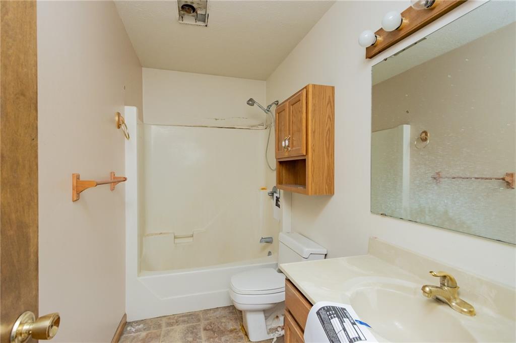 333 Butler Street Springdale, PA 15144 - Photo 15 of 17 a bathroom with a sink toilet and shower