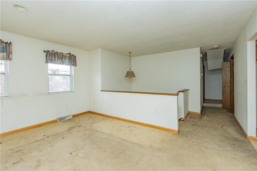 333 Butler Street Springdale, PA 15144 - Photo 6 of 17 an empty room with windows