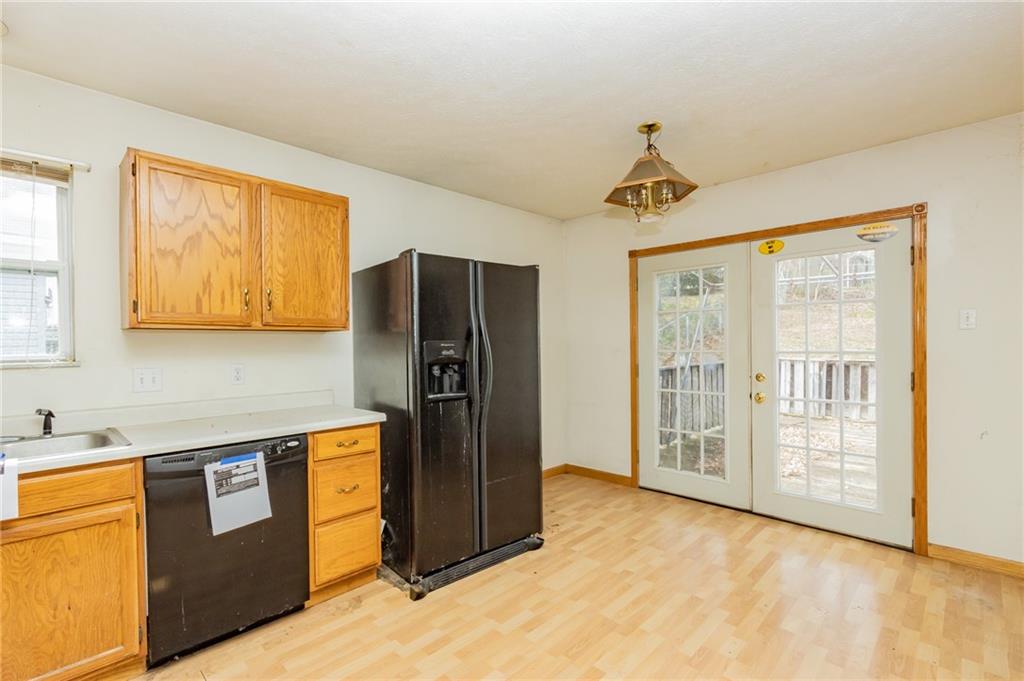 333 Butler Street Springdale, PA 15144 - Photo 10 of 17 a kitchen with stainless steel appliances granite countertop a refrigerator and a sink