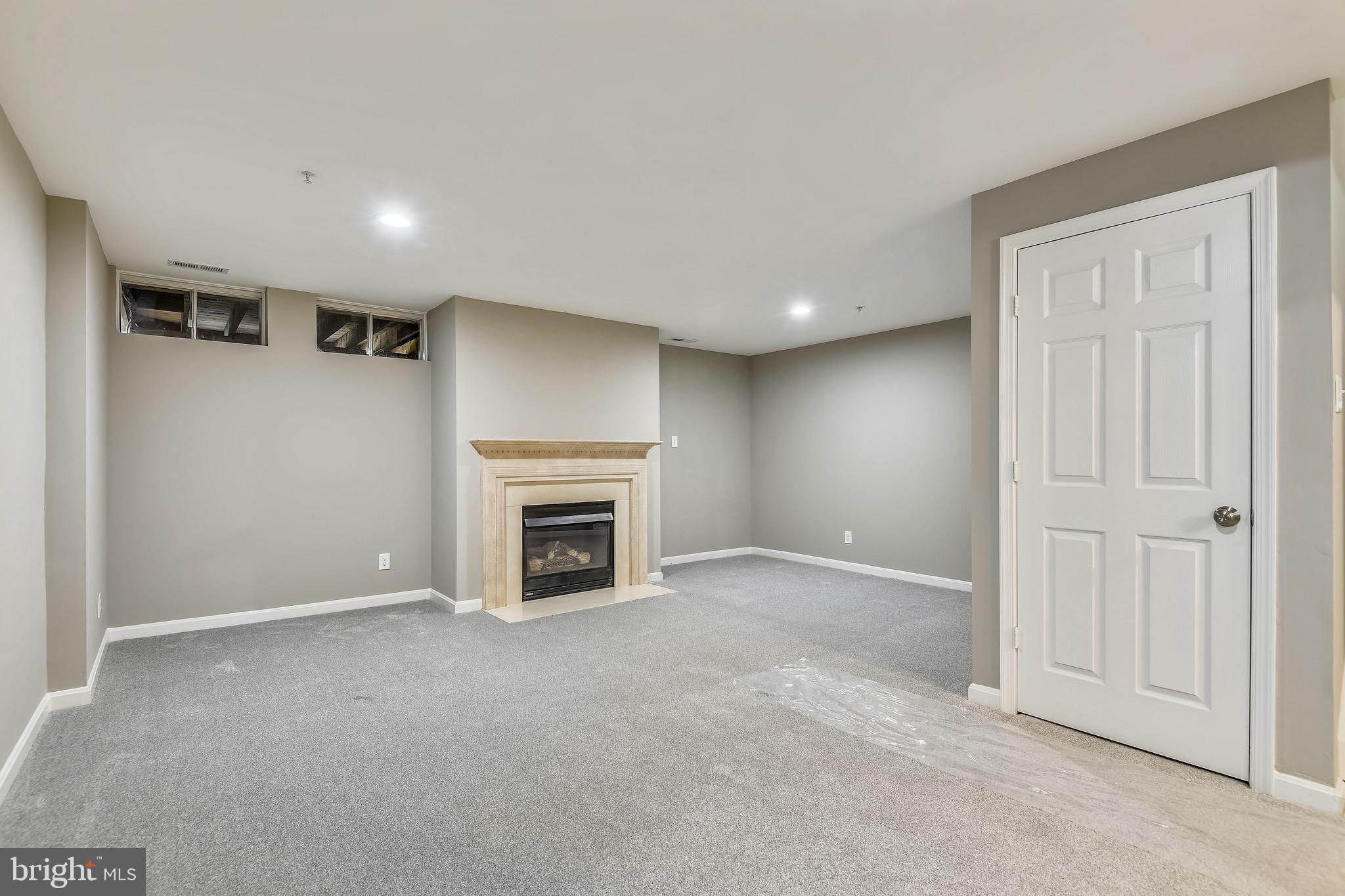 3810 Colony Point Place Edgewater, MD 21037 - Photo 27 of 61 Fully finished basement with fireplace