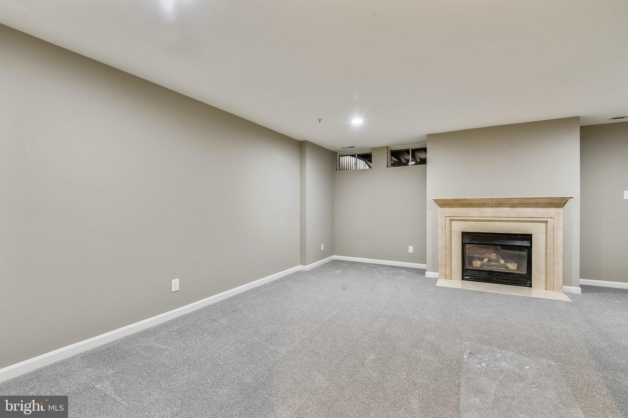 3810 Colony Point Place Edgewater, MD 21037 - Photo 28 of 61 Fully finished basement with fireplace
