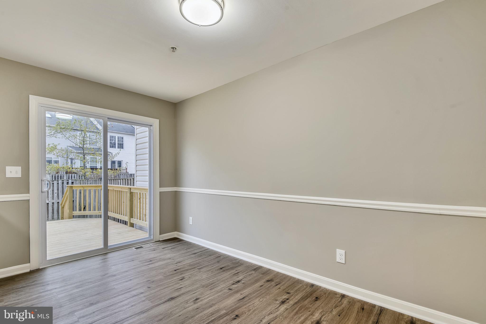 3810 Colony Point Place Edgewater, MD 21037 - Photo 9 of 61 Eat-in kitchen/Dining table space leading to deck