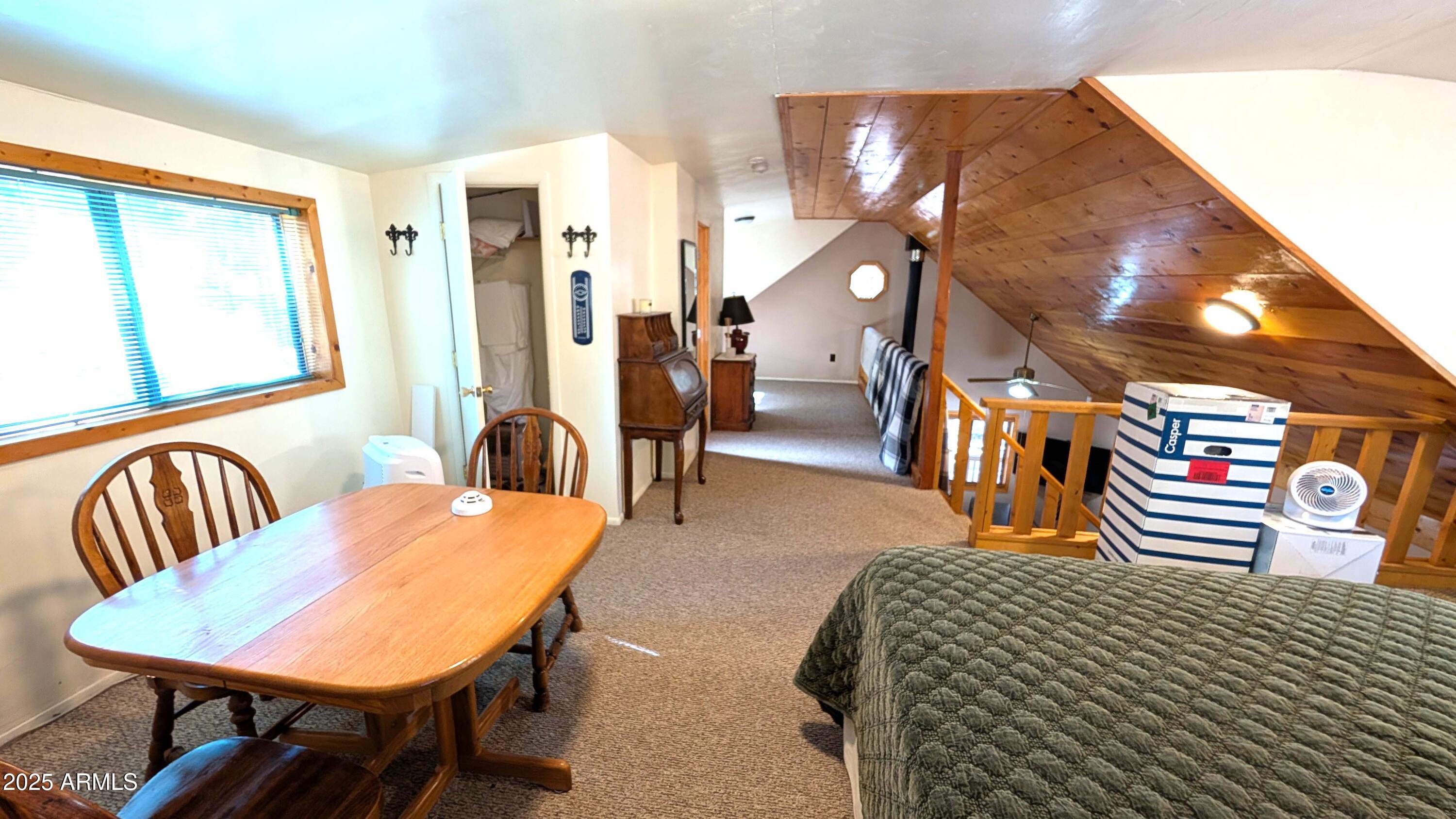 2425 Tall Trees Loop Forest Lakes, AZ 85931 - Photo 14 of 43 a dining room with furniture and wooden floor