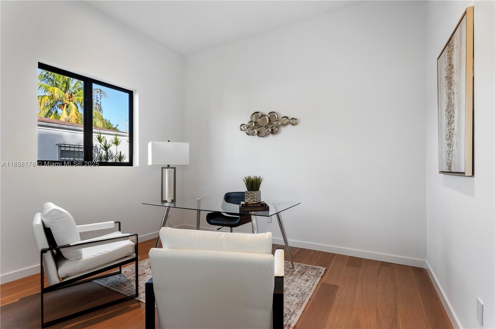 2434 Southwest 19th Street Miami, FL 33145 - Photo 13 of 18 a room with a window and a chair