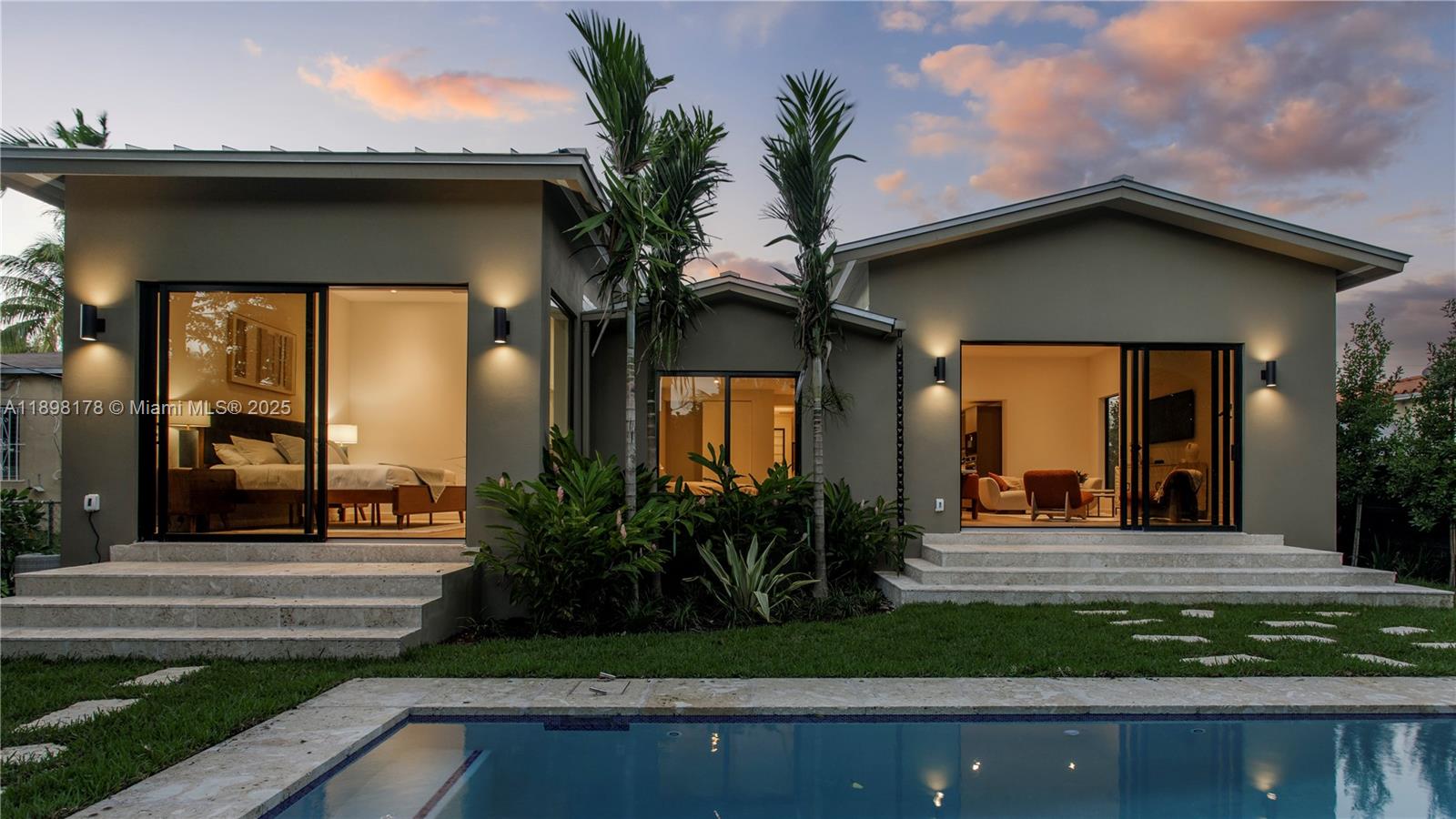 2434 Southwest 19th Street Miami, FL 33145 - Photo 17 of 18 a front view of a house with garden