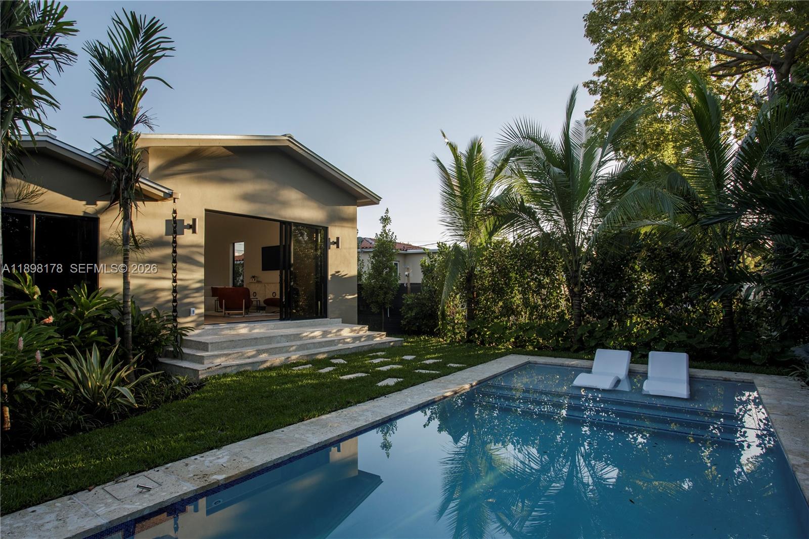 2434 Southwest 19th Street Miami, FL 33145 - Photo 17 of 18 a front view of a house with garden