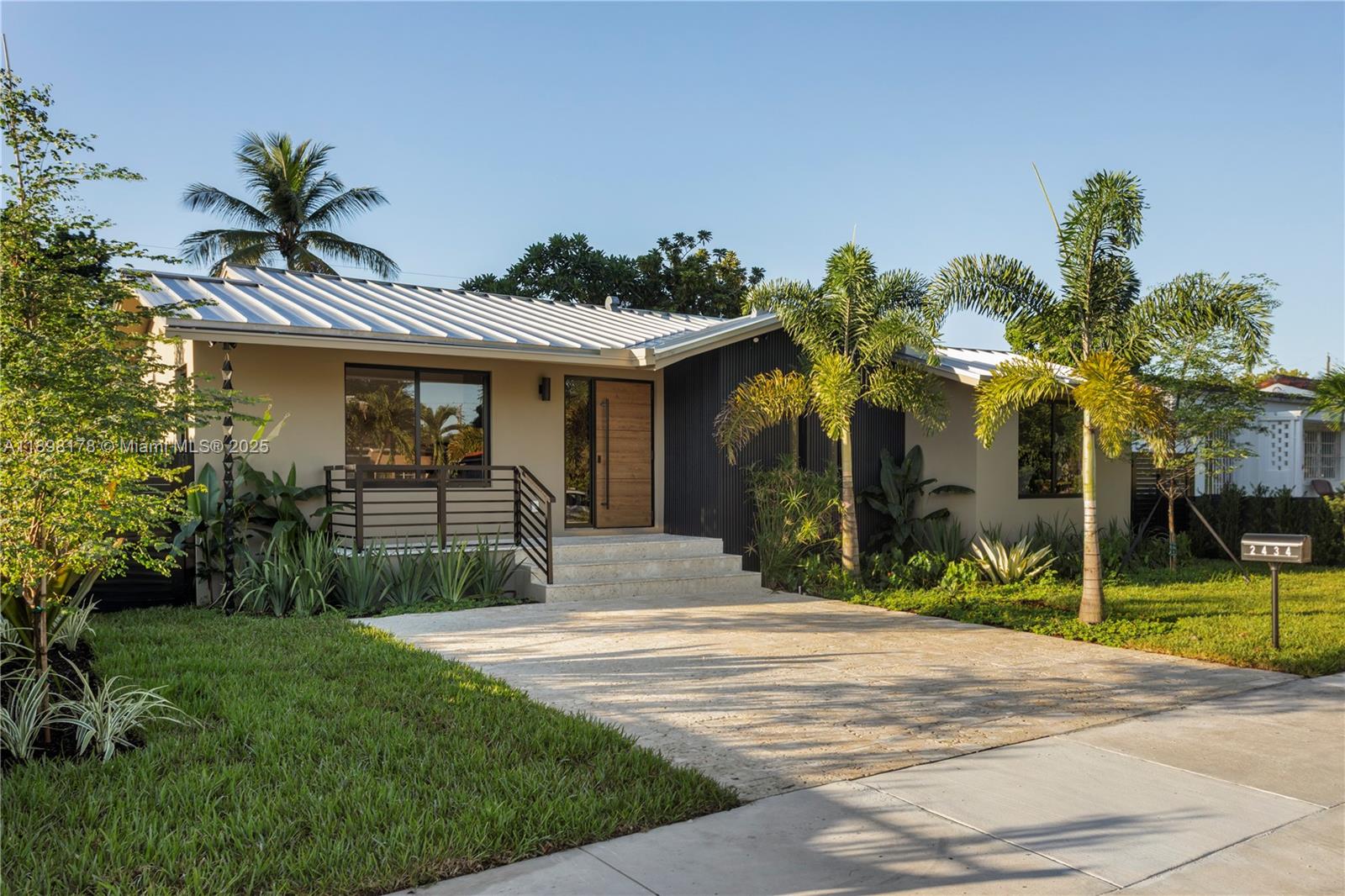 2434 Southwest 19th Street Miami, FL 33145 - Photo 2 of 18 a front view of a house with a garden