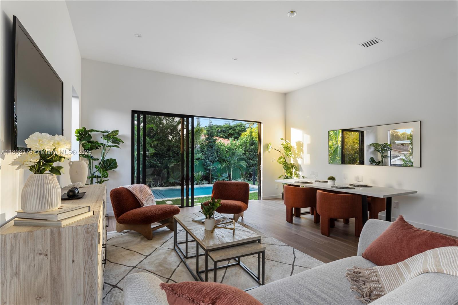 2434 Southwest 19th Street Miami, FL 33145 - Photo 3 of 18 a living room with furniture and a window