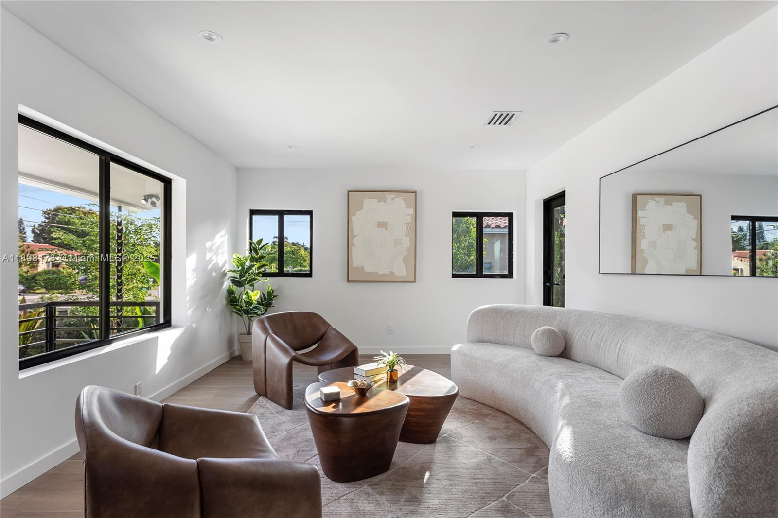 2434 Southwest 19th Street Miami, FL 33145 - Photo 8 of 18 a living room with furniture and a large window