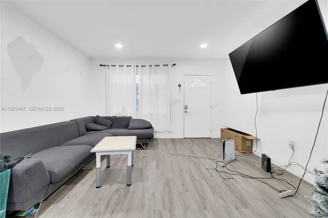 a bathroom with a sink toilet vanity and shower