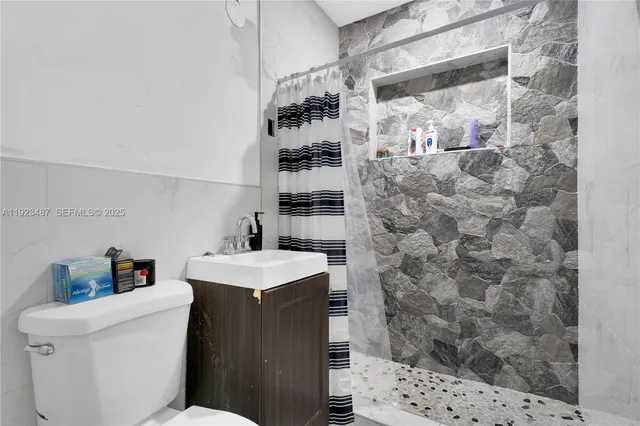 a bedroom with bed and wooden floor