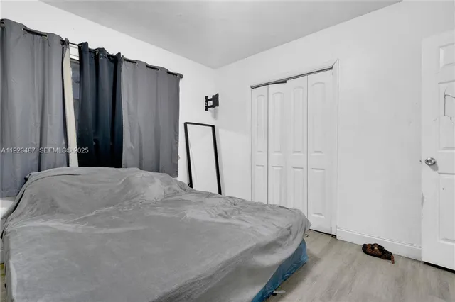 a view of a livingroom with an empty space and a flat screen tv