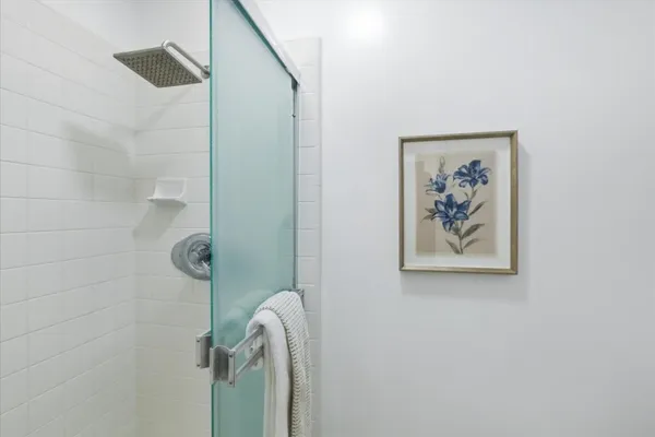 a view of entryway with furniture and wooden floor