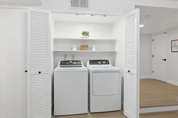 an aerial view of a houses with a yard