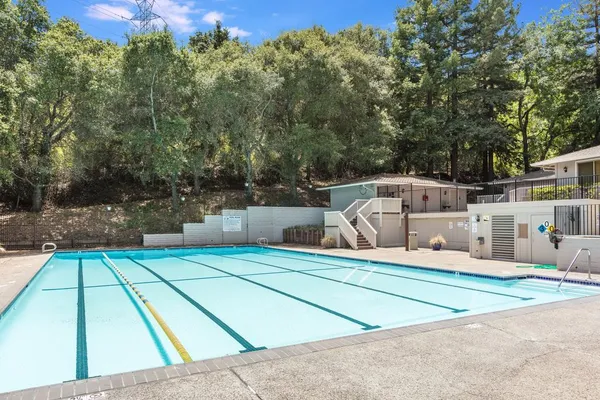 an aerial view of a house with swimming pool